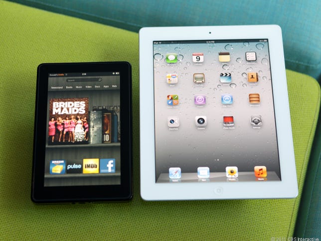 Amazon's 7-inch Kindle Fire next to the iPad.
