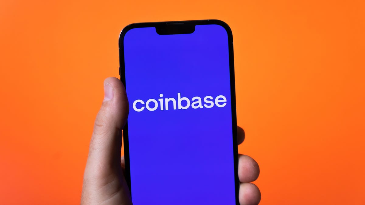 The Coinbase logo on an iPhone 13 Pro
