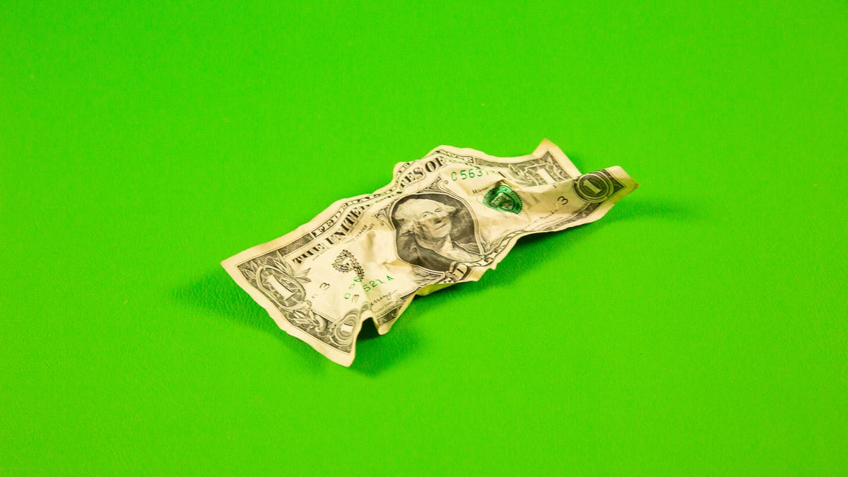 A crumpled $1 bill
