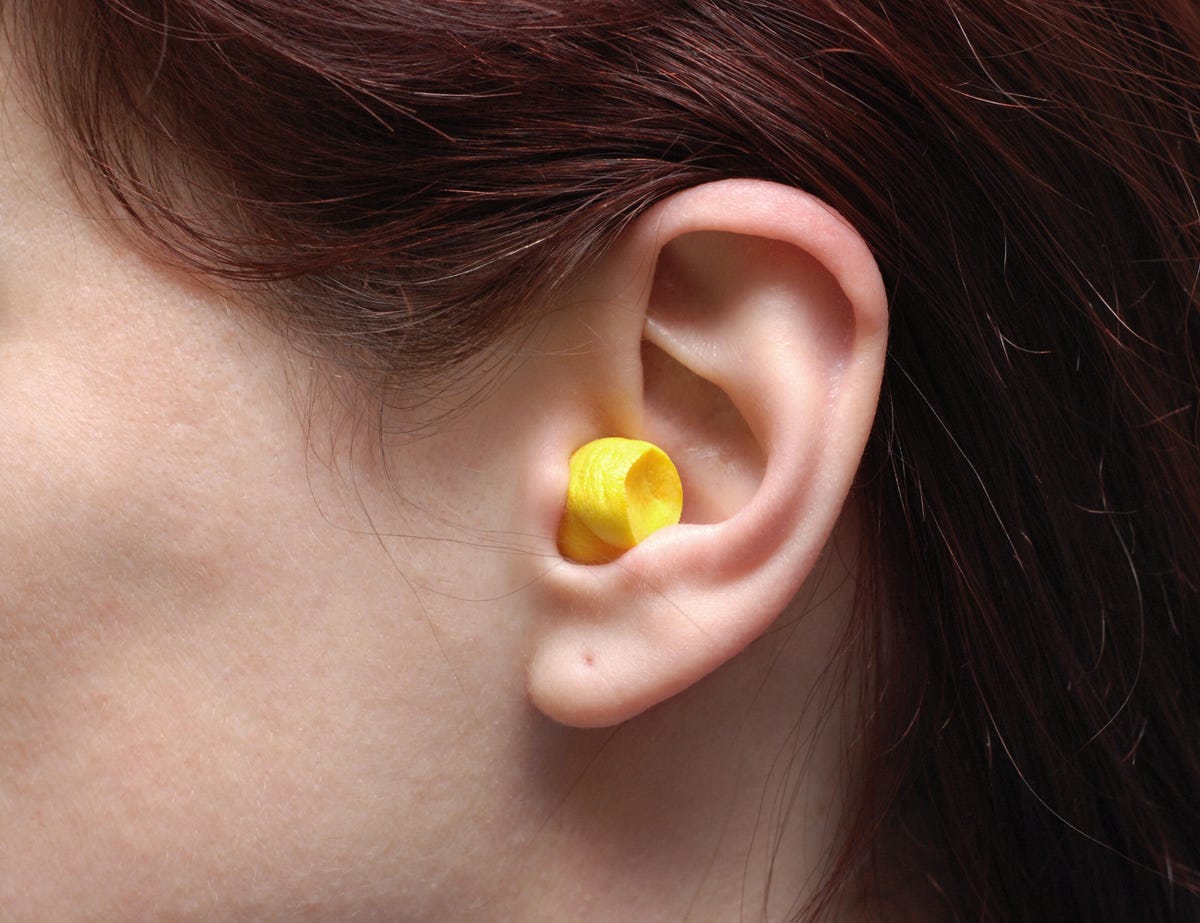 One single ear with a ear plug in it.