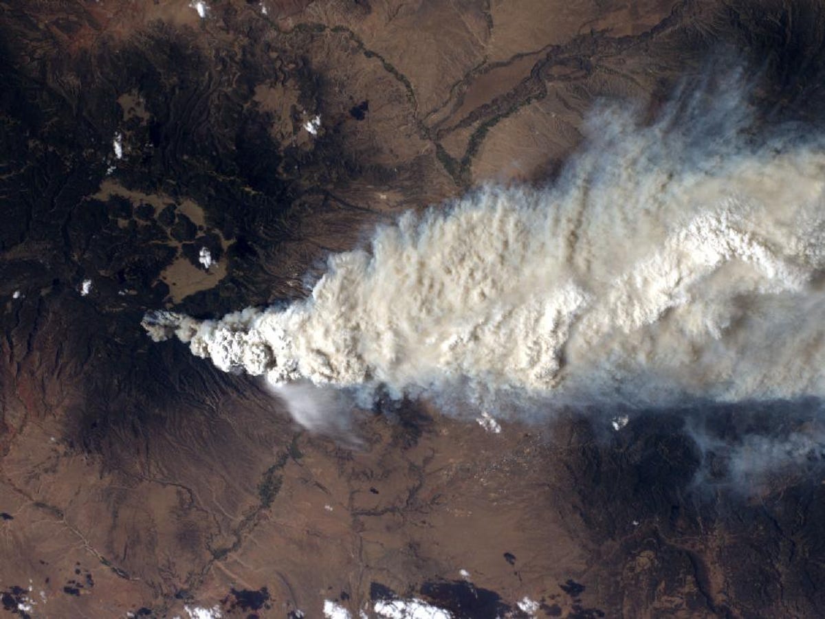 An International Space Station crew member took this photo of the Las Conchas fire near Los Alamos, N.M., on Monday, June 27, the fire's second day. The green mountains to the left (west) are the Jemez Mountains, a large volcano featuring a sunken ring-shaped caldera left from its last massive eruption 1.1 million years ago. The city of Los Alamos s just above the edge of the smoke where the green Jemez forests fade to a more arid brown. The Rio Grande flows from near the upper right corner to the lower left.