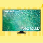 The Samsung Neo QLED QN85C 4K TV is displayed against a yellow background.