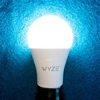 A Wyze smart bulb, lit up