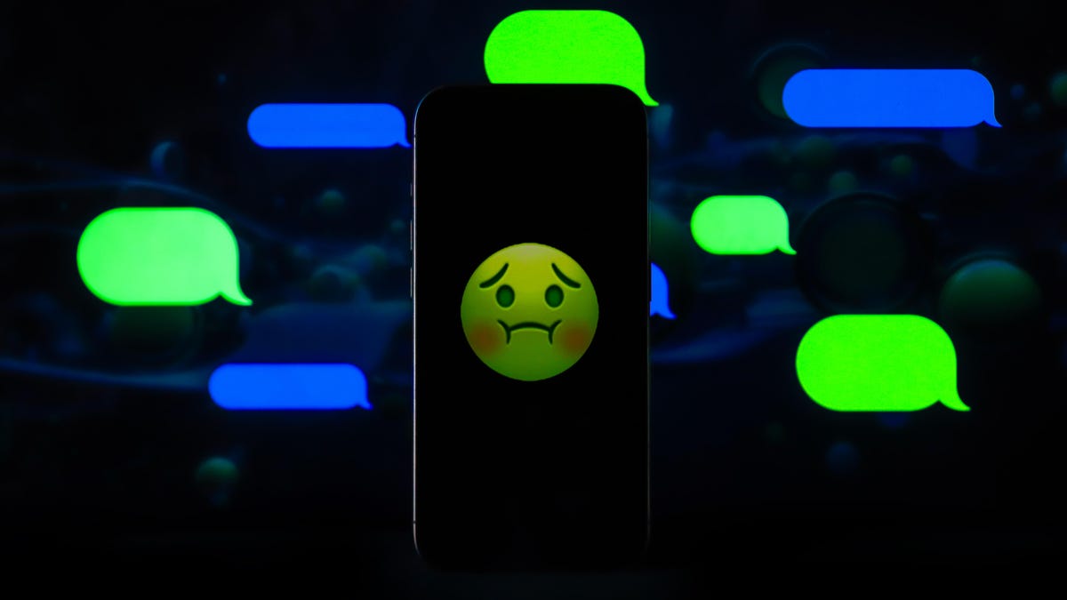 An illustration portraying the mix of blue and green bubbles on iPhone&apos;s iMessage service, with a sick-face emoji. 