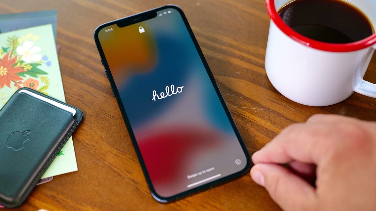 A welcome screen reads "hello" in cursive on an iPhone