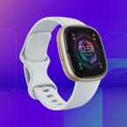 The Fitbit Sense 2 fitness tracker is displayed against a gradient blue and purple background.