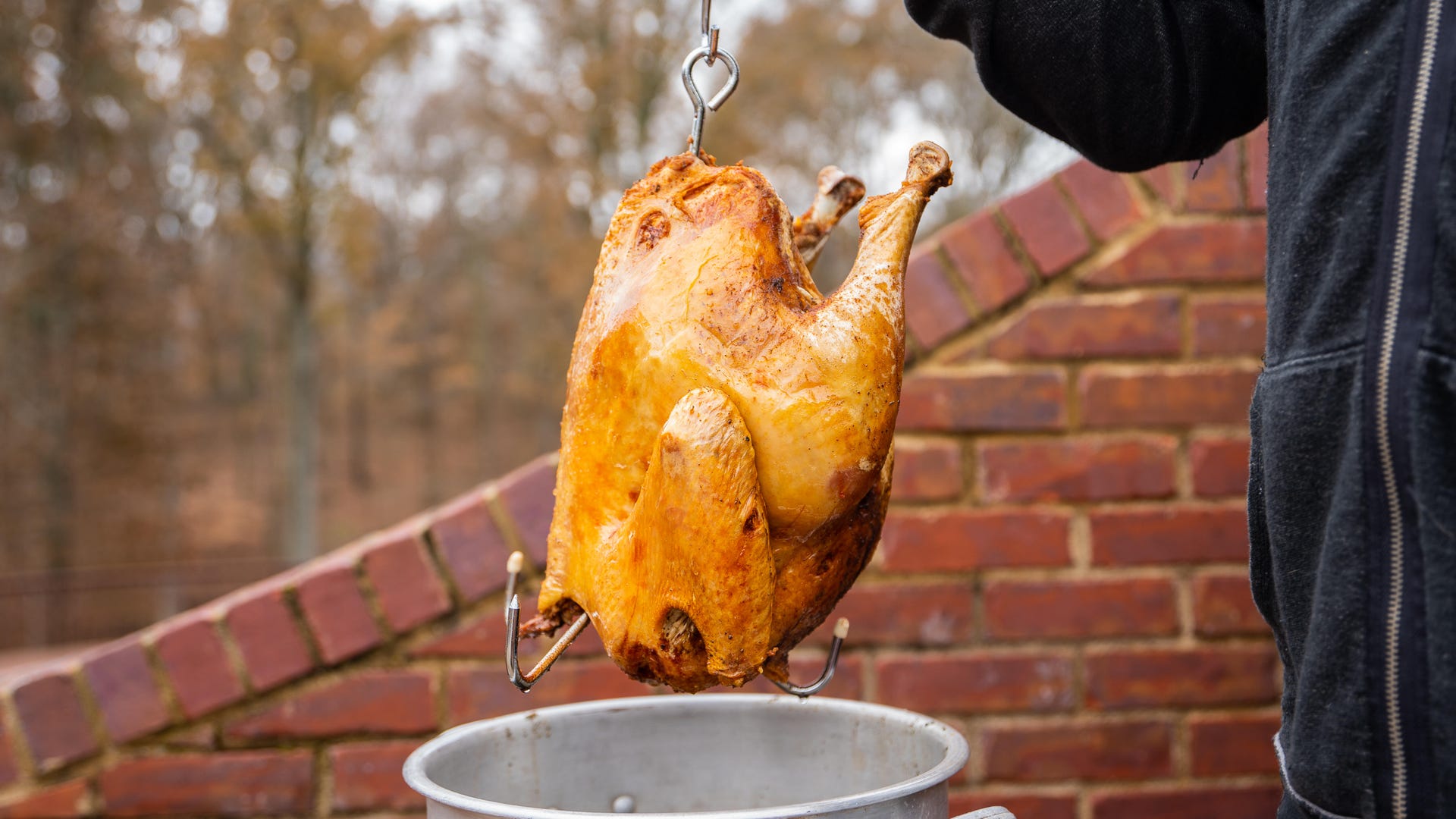 turkey coming out of a deep fryer