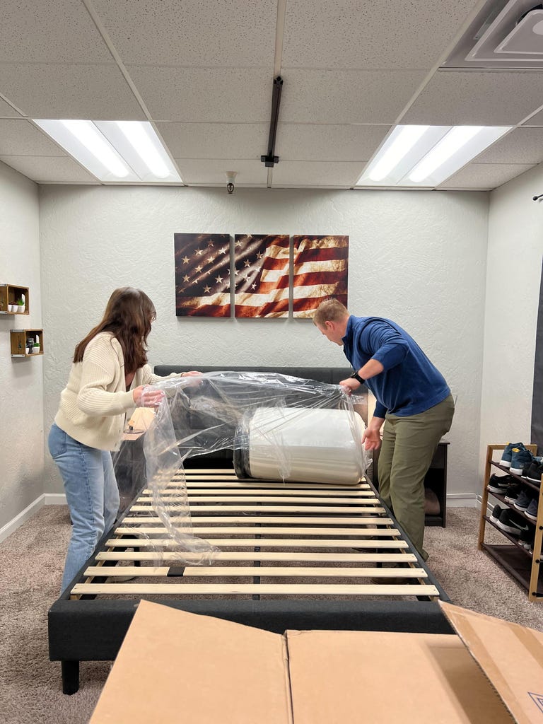 Caroline and Dillon unboxing the DreamCloud mattress
