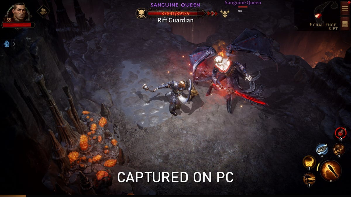 A armored warrior in battles a winged demon in a shadowy cave in Diablo Immortal, with a caption saying "CAPTURED ON PC" in white text
