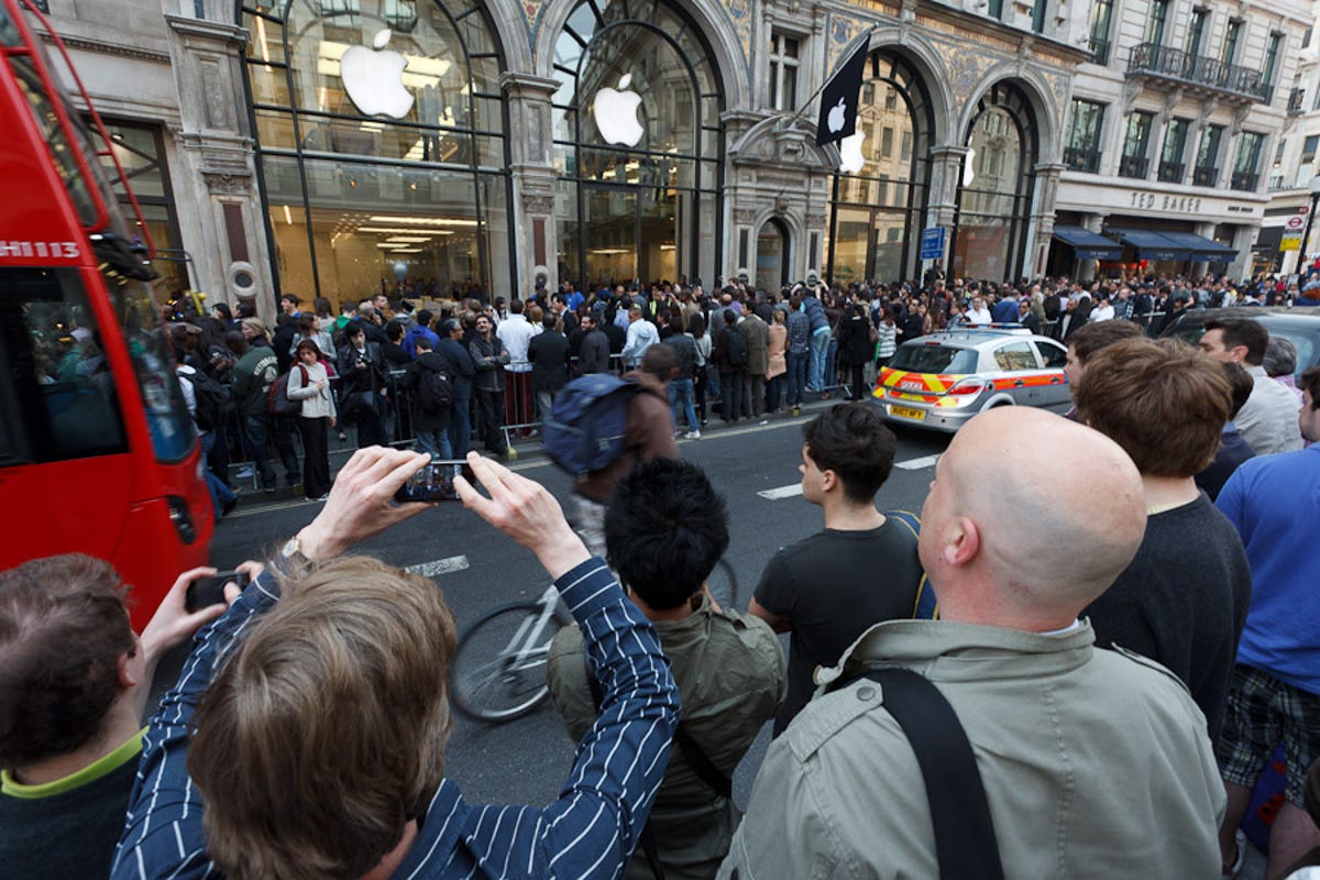 A throng gathered around Apple's London store at Oxford Circus as the first iPads in the country went on sale. Most of this crowd are just watching, but several hundred buyers lined up to buy the tablets, too.