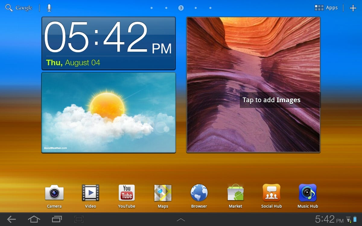 Galaxy Tab 10.1 with TouchWiz home screen.
