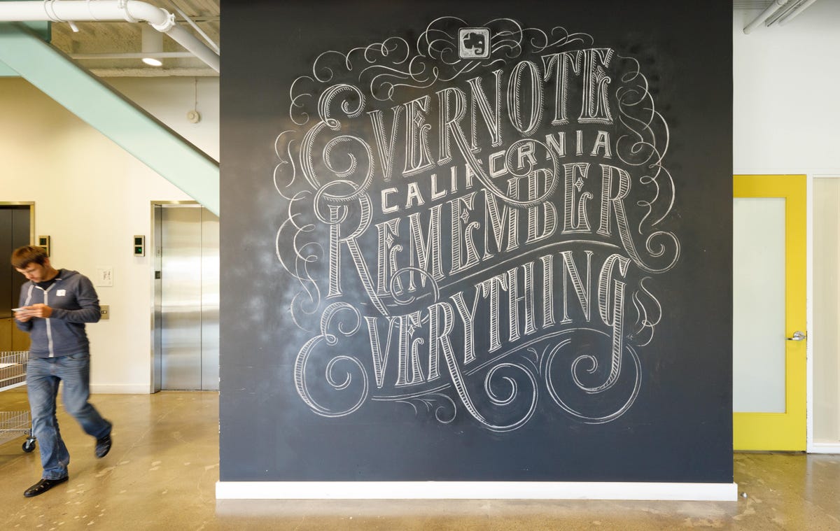 Elaborate chalkboard calligraphy declares "Evernote California remember everything" at the company's headquarters.