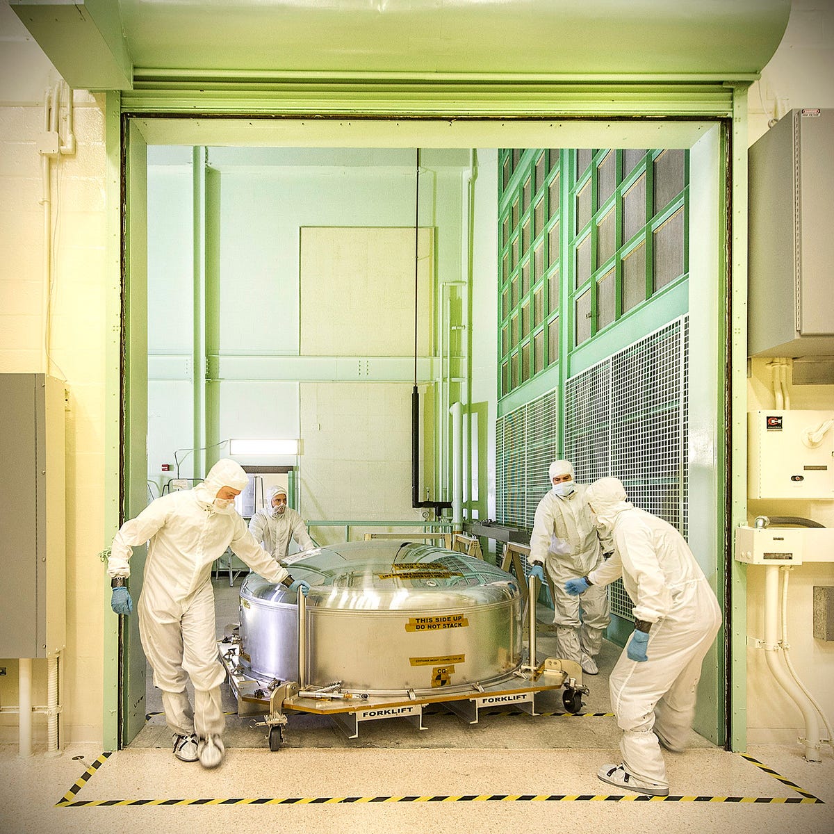 The James Webb Space Telescope ETU (engineering test unit) primary mirror segment returning to the cleanroom at NASA Goddard.