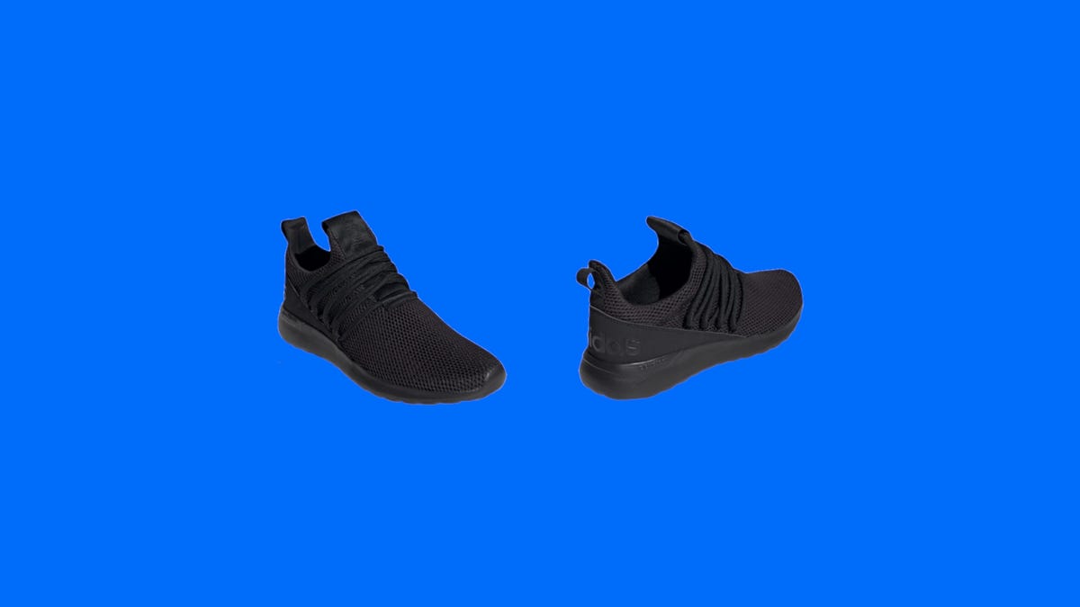 A pair of black men's Adidas on a blue background