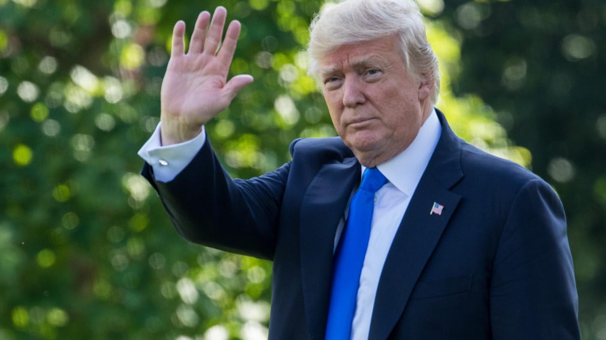 President Donald Trump waves