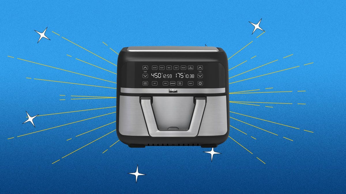 The Bella Pro Series 9-quart stainless steel air fryer against a blue background