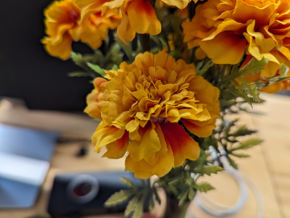 Artificial flowers on a desk.