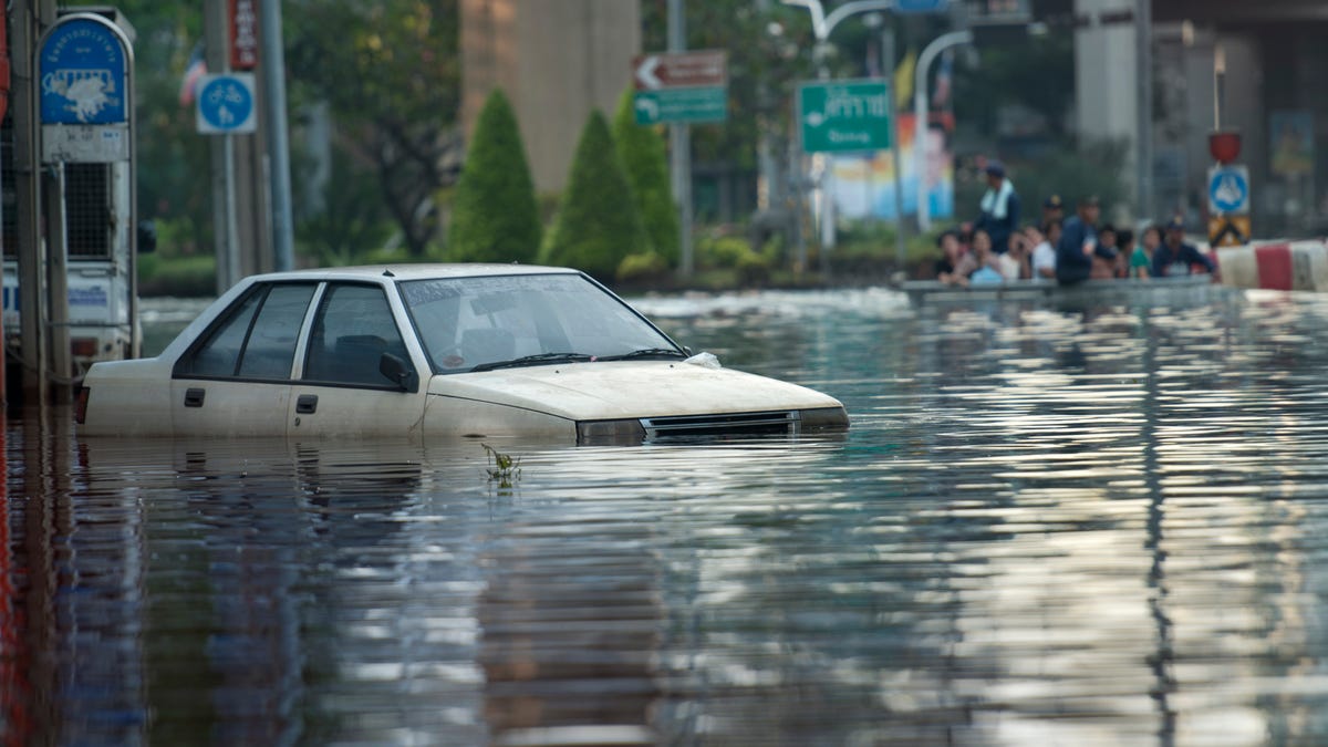 A car in flooded streets.