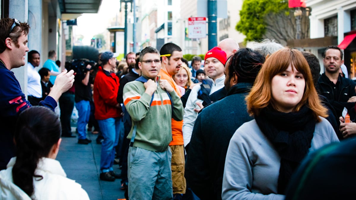 People line up for an iPhone 3GS last year.