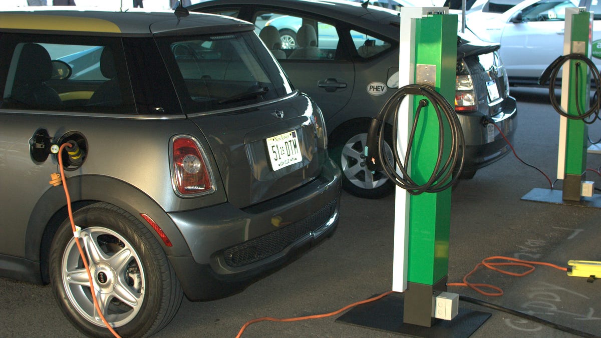 An electric mini and plug-in hybrid charging up.