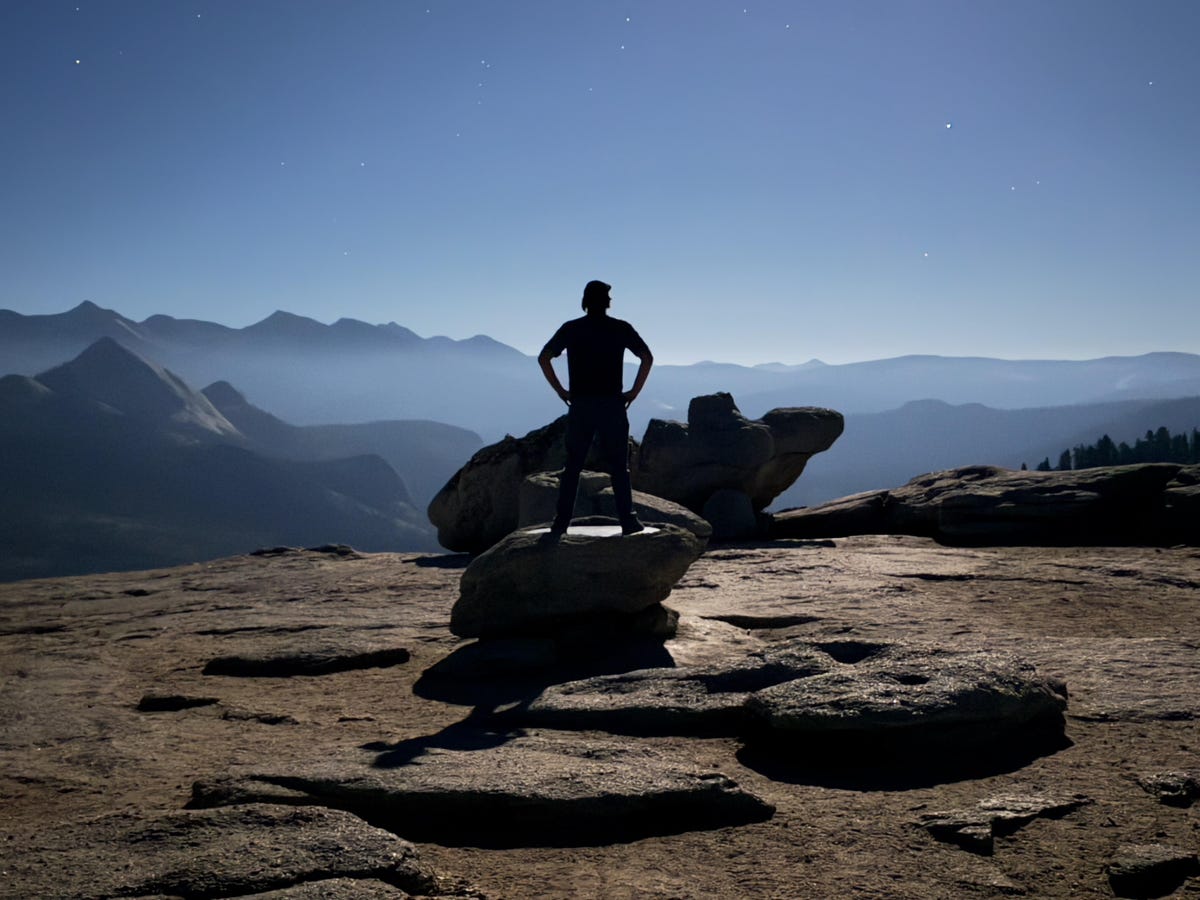 Self portrait shot on iPhone 15 Pro Max mounted on a tripod on top of Sentinel Dome in Yosemite National Park.