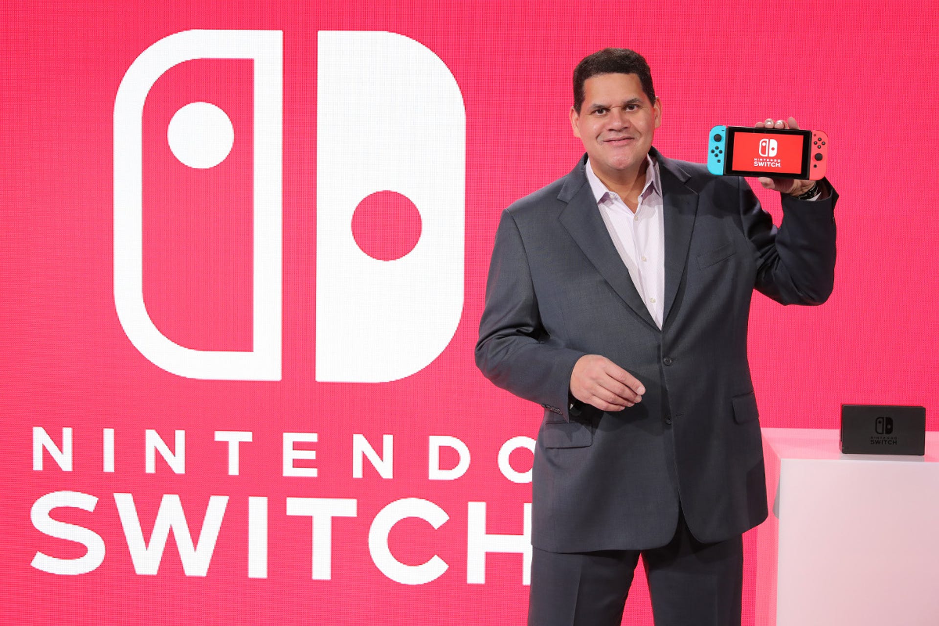Nintendo of America President Reggie Fils-Aime. That Switch held in his hand is not actually a handheld. Not primarily anyway, he tells us.