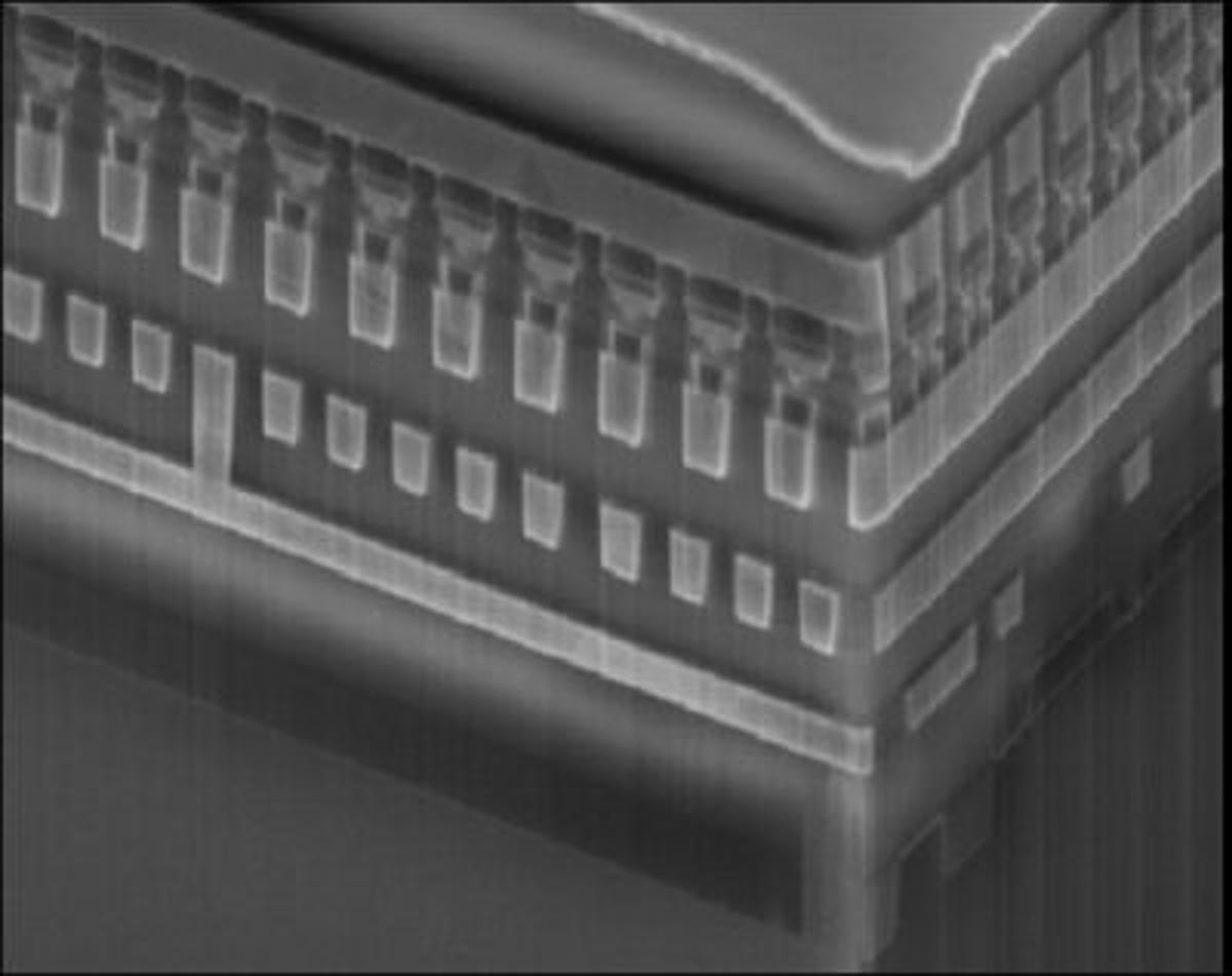 This image shows phase change memory built atop a conventional CMOS microchip. Memory cells can be controlled using rows and columns of wires that lead through the chip.