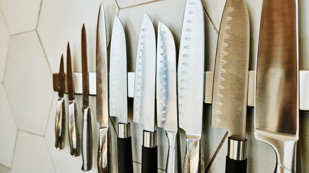 Kitchen knives hanging on a wall rack