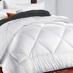 the TEKAMON comforter draping a mattress.
