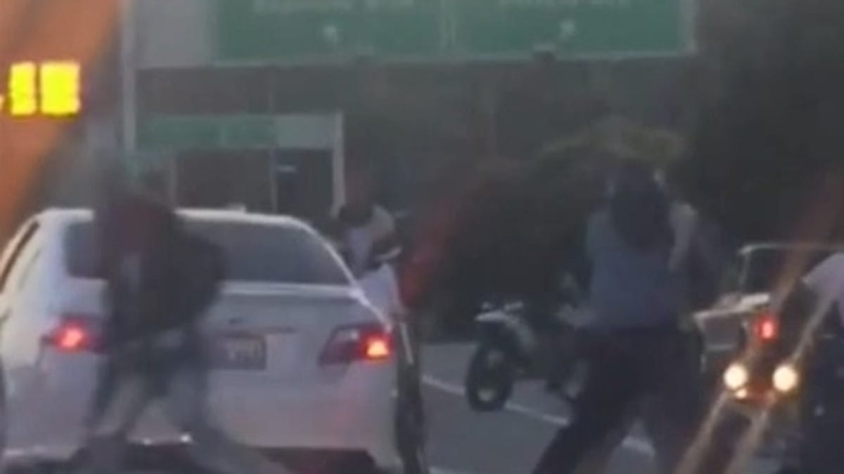 A cell phone video shows attackers beating a driver on a San Francisco freeway during Wednesday evening's commute.
