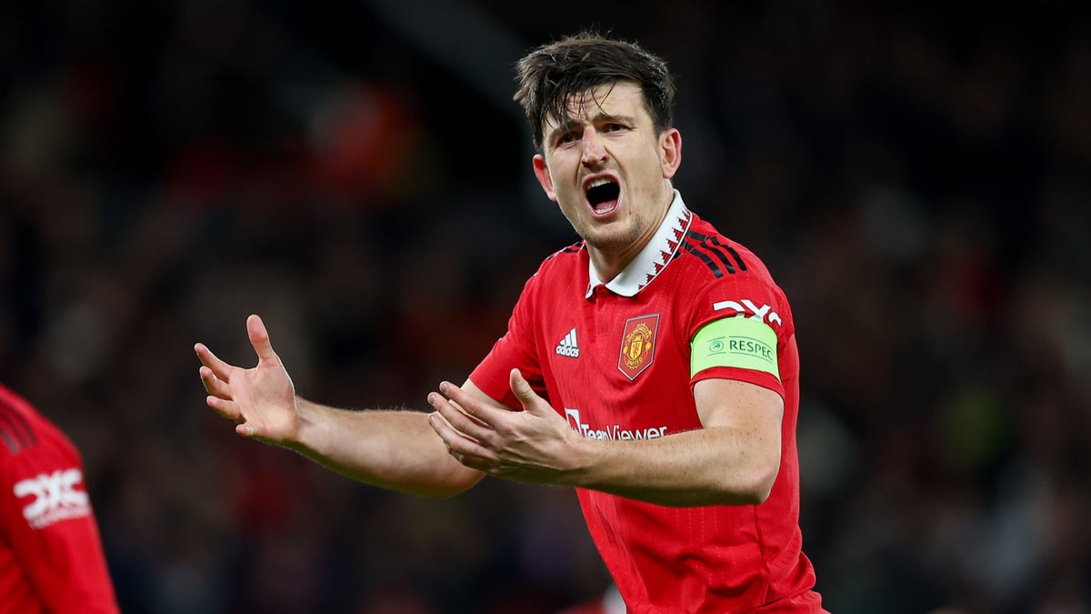 Manchester United defender Harry Maguire shouting and gesturing with his hands.