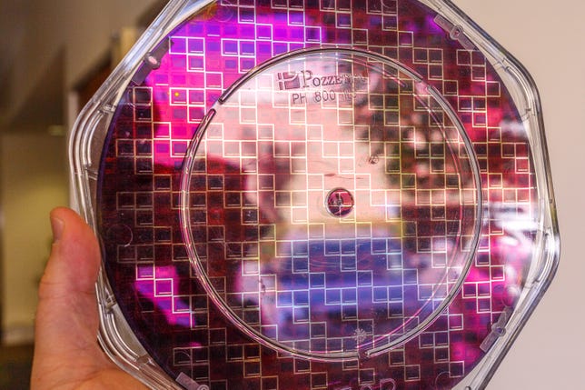 A circular wafer of InVisage image sensor chips reflects light -- but not as much, since the dots absorb light better than conventional silicon-based microchip sensors.