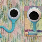 A baby monitor that looks like a turquoise worm 