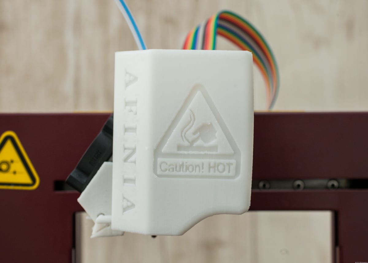 The Afinia H479's extruder cover is made from 3D printed plastic.