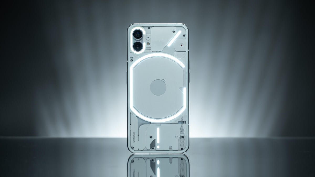 The back of the Nothing Phone 1 with its lights on