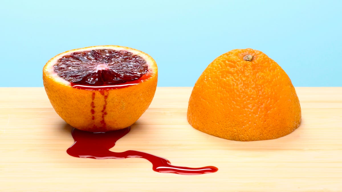 blood orange sliced in half with juice.