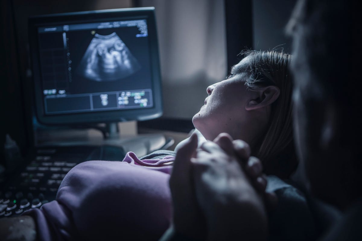 A woman undergoes an ultrasound examination