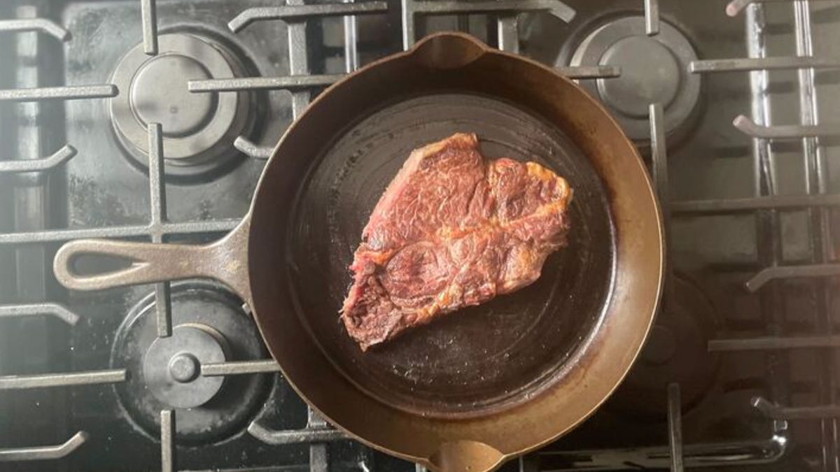 steak in pan on stove