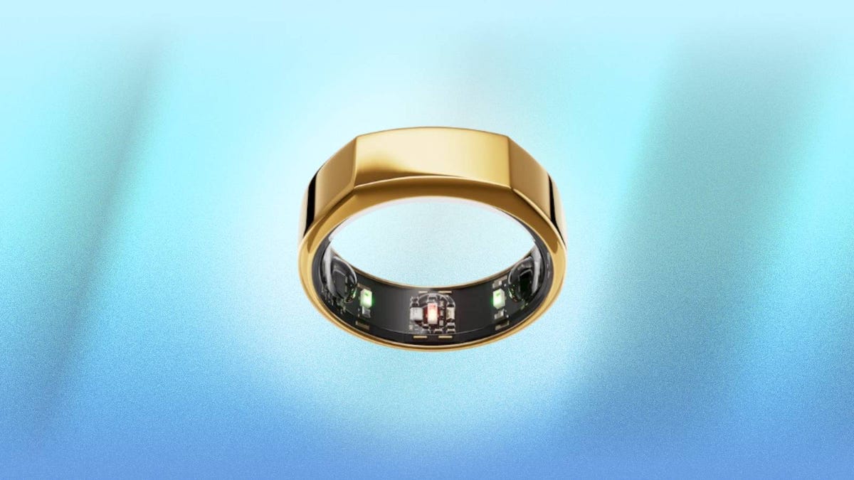 The Gold Heritage edition of the Oura Ring Gen 3 is displayed against a blue background.