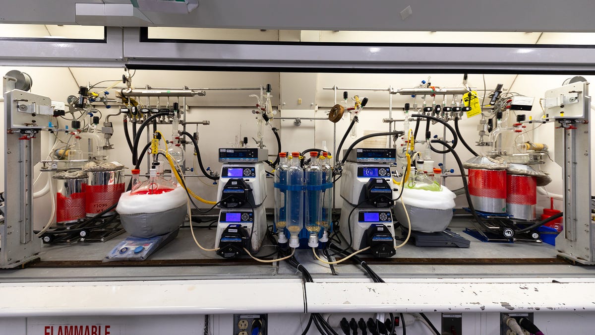Pipes connected to glowing flasks of quantum dots.