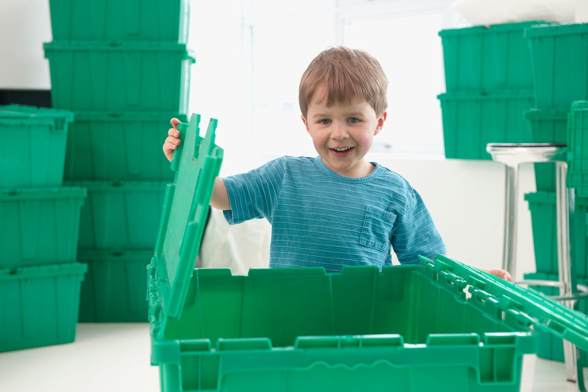 Child with plastic moving boxes