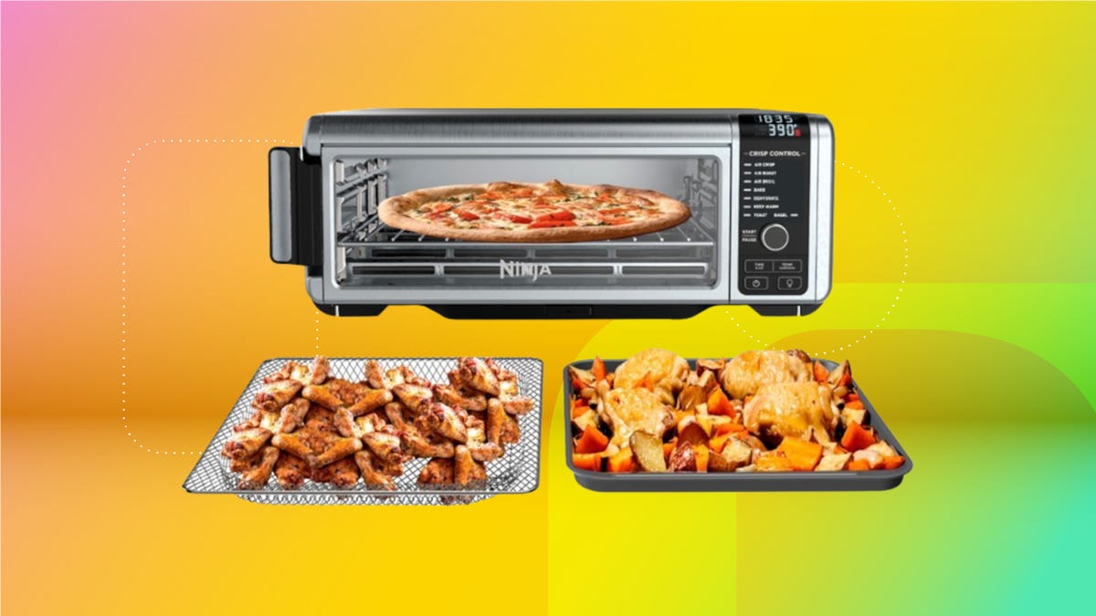 The Ninja Foodi air fryer toaster oven and several dishes of food are displayed against a gradient orange, yellow and green background.