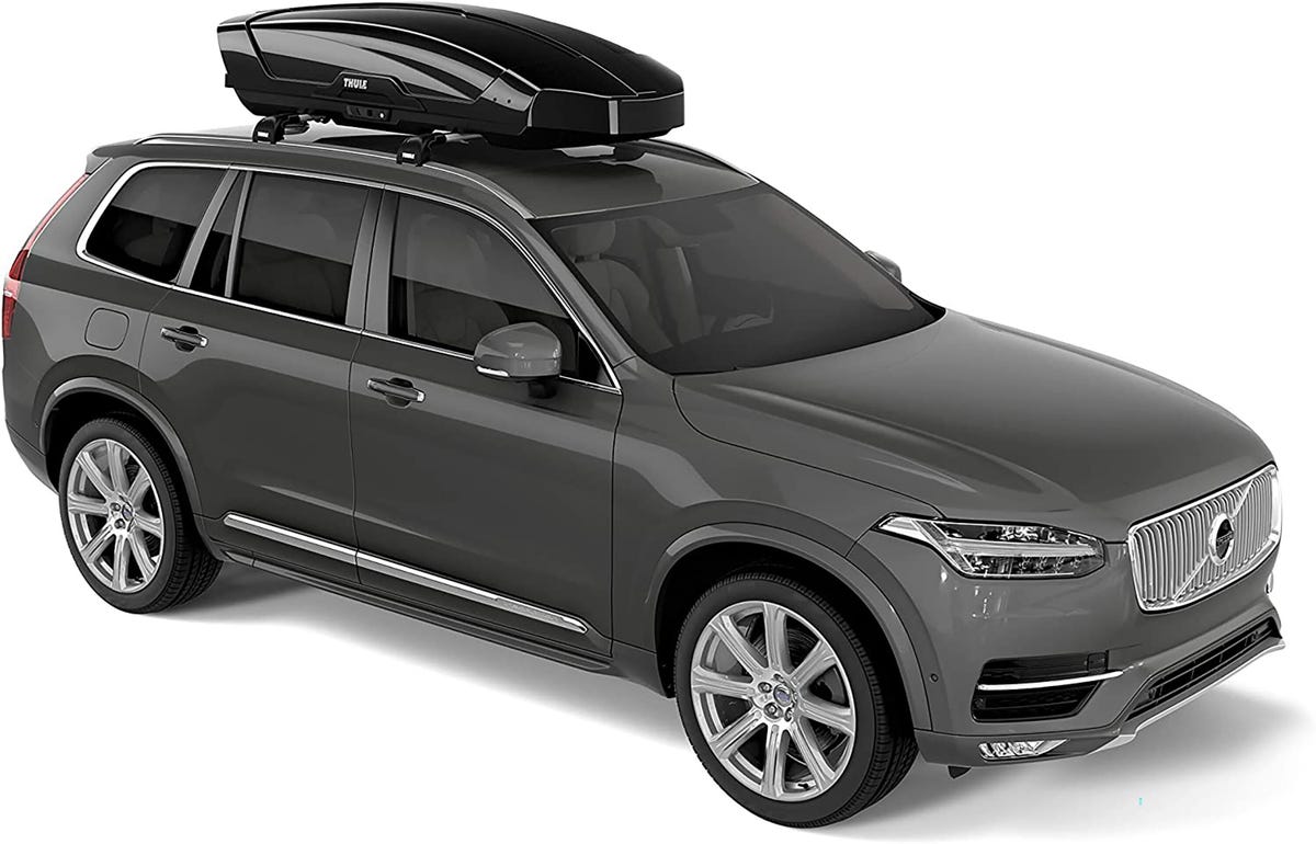 Thule Motion XT Rooftop Cargo Carrier mounted on top of a Volvo SUV