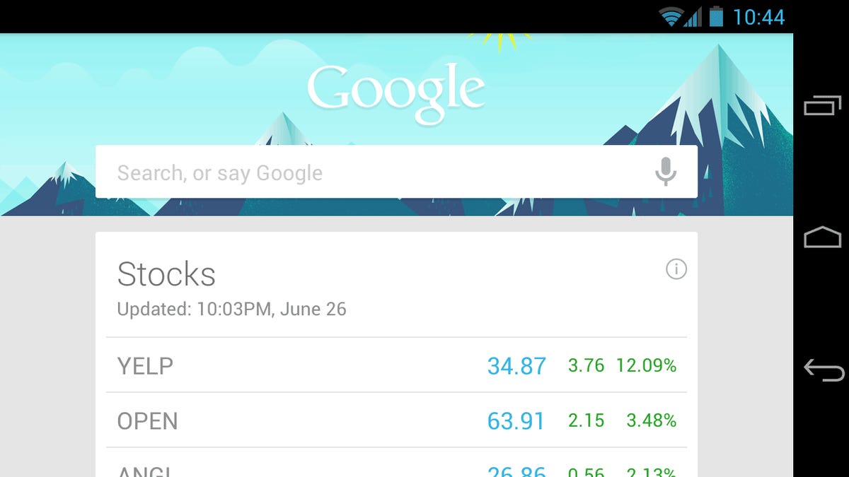 Google Now cards, such as these stock prices, appear underneath the search box on Android, accessed by swiping up from the bottom of the screen.
