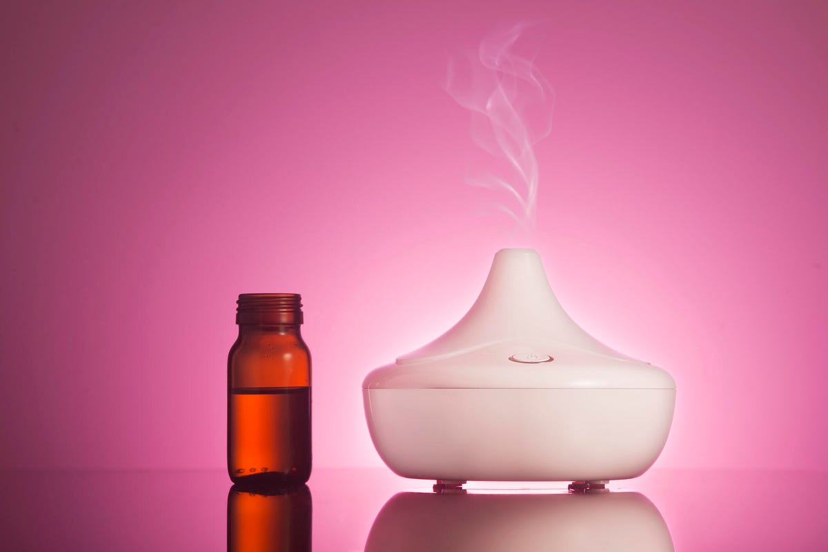 Essential oil diffuser with a small bottle of essential oil