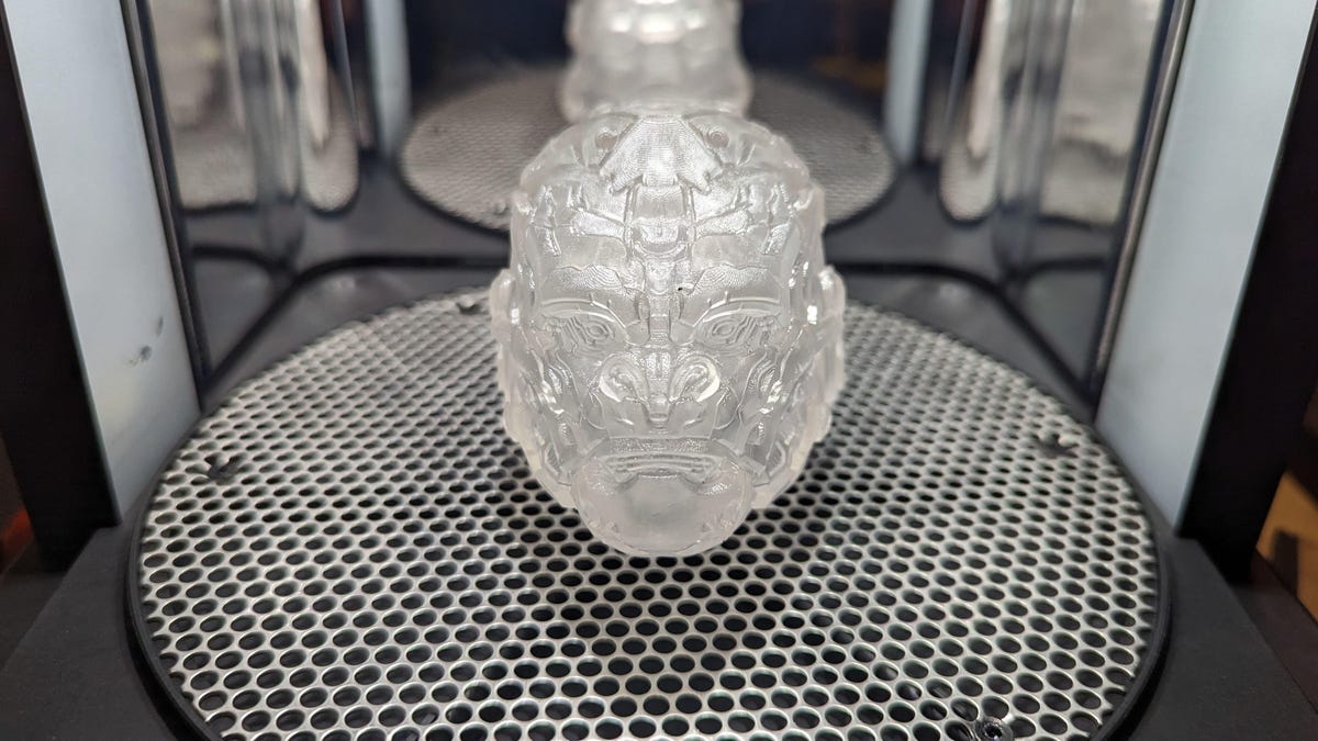 A clear head of Optimus Primal on the Formlabs Cure plate