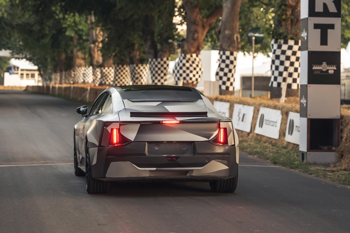 Rear view of a camouflaged Polestar 5 EV prototype at Goodwood Festival of Speed
