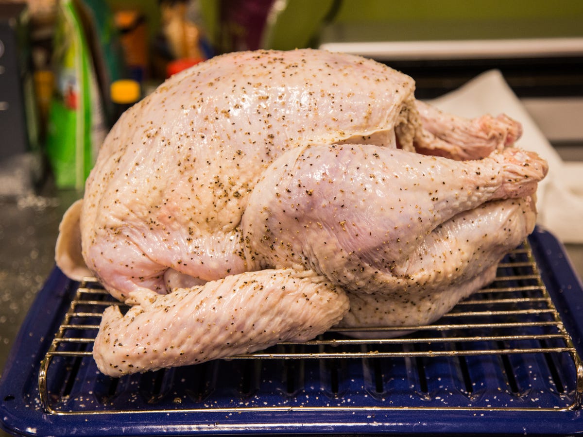 raw turkey on roasting rack