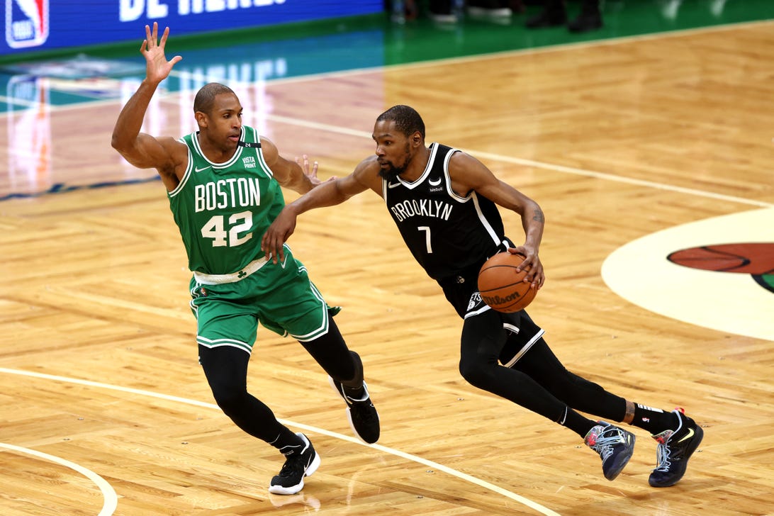 Al Horford of the Celtics tries to block Kevin Durant of the Nets