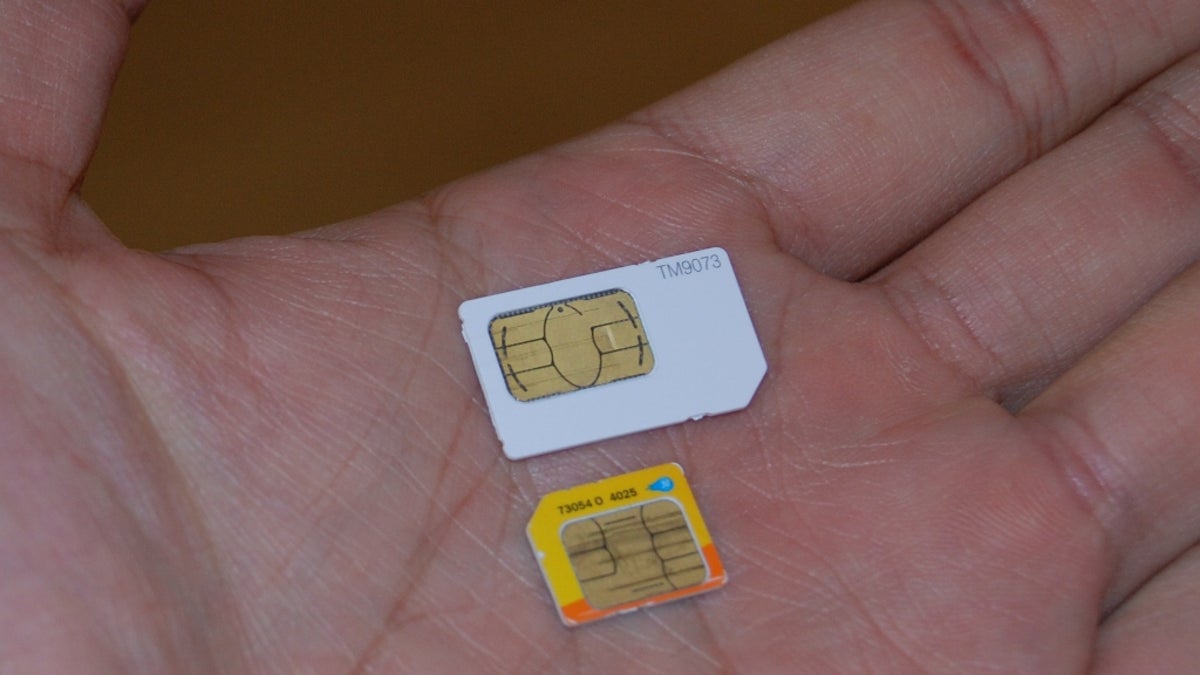 A regular SIM card and a micro-SIM card for the iPhone 4.